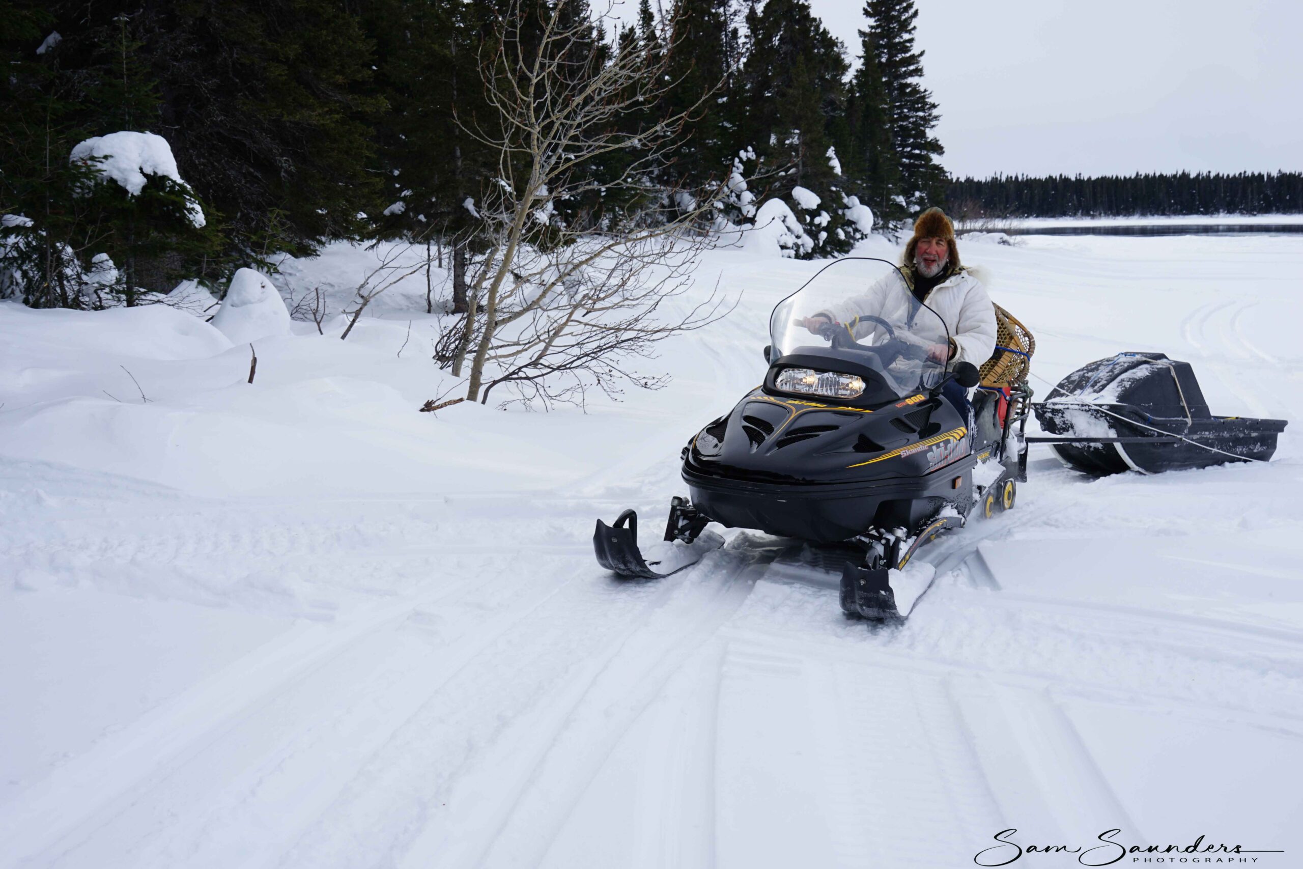 Sam Saunders driving a ski-doo