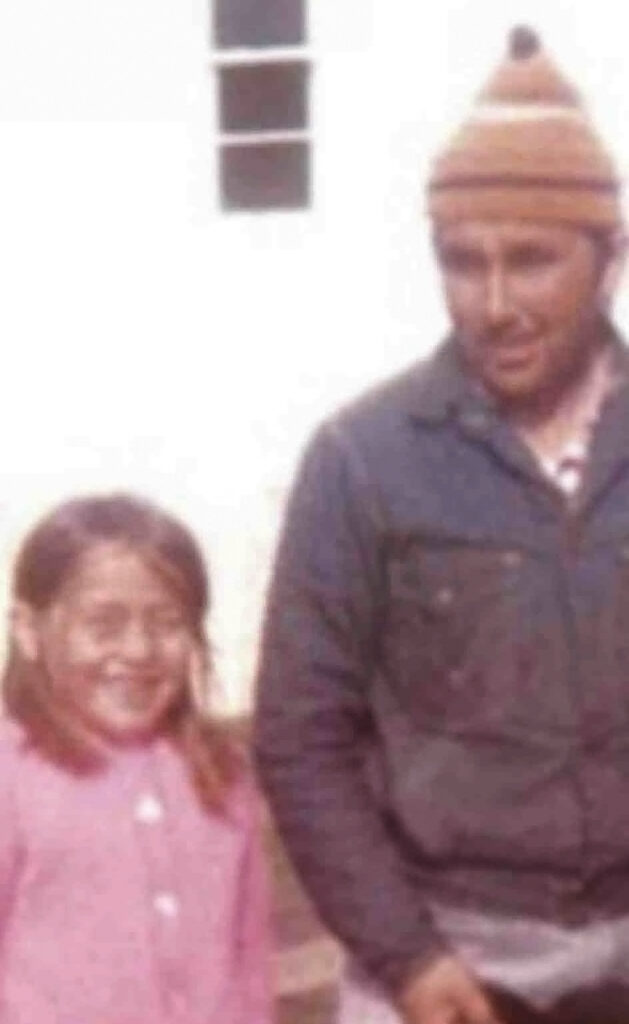 Ola Andersen as a young girl with her father, in Makkovik, in the 1970s